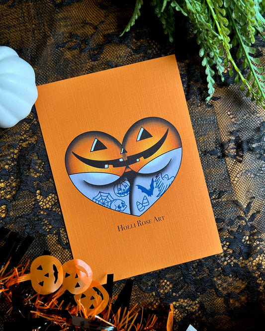 a print of a booty in the shape of a heart, wearing jack o lantern underwear