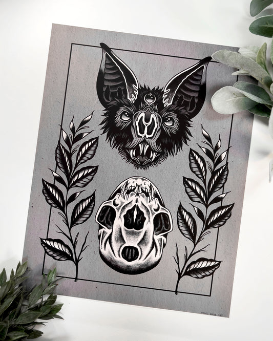 art print of a bat head and a bat skull below it
