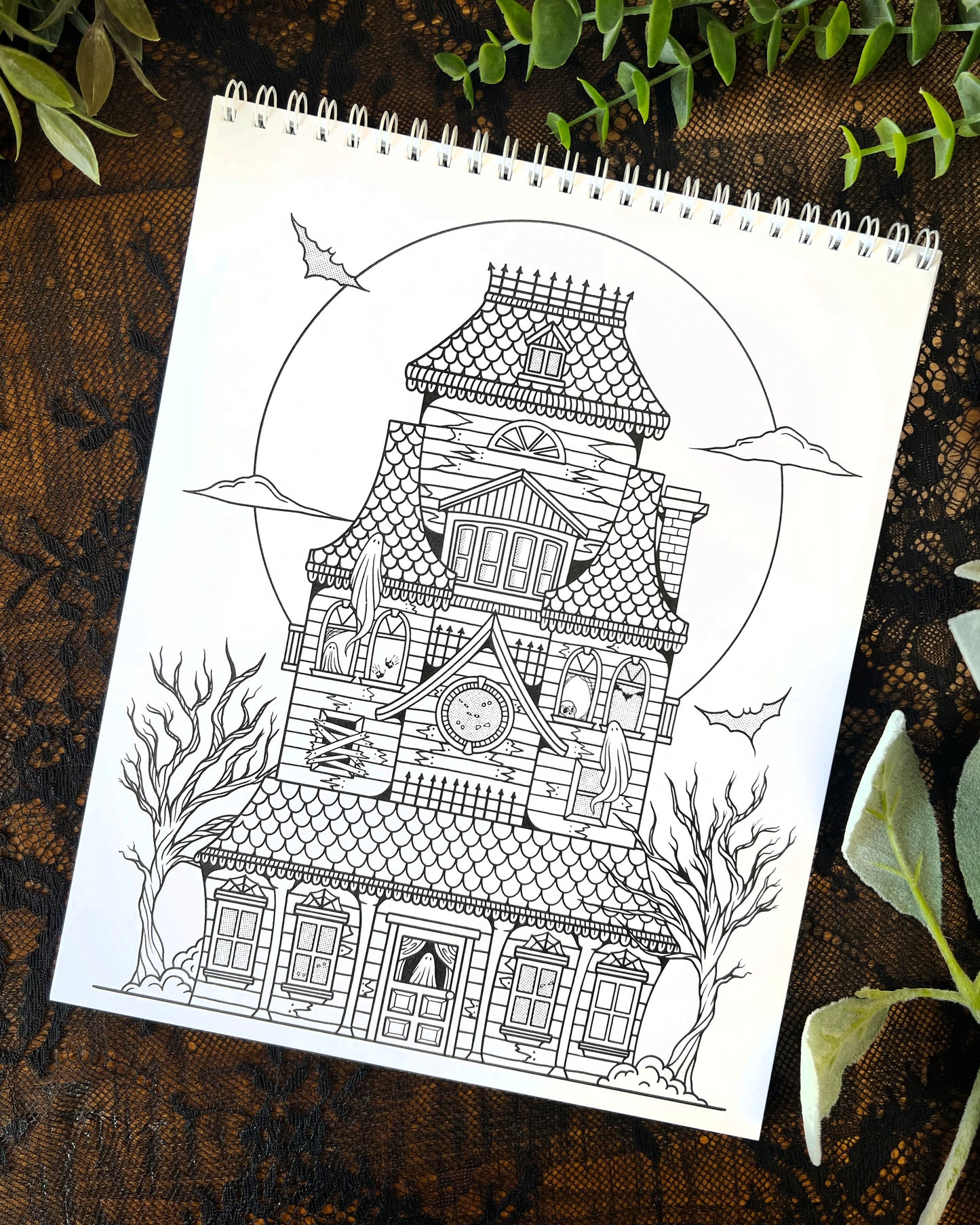 a coloring page with a haunted house