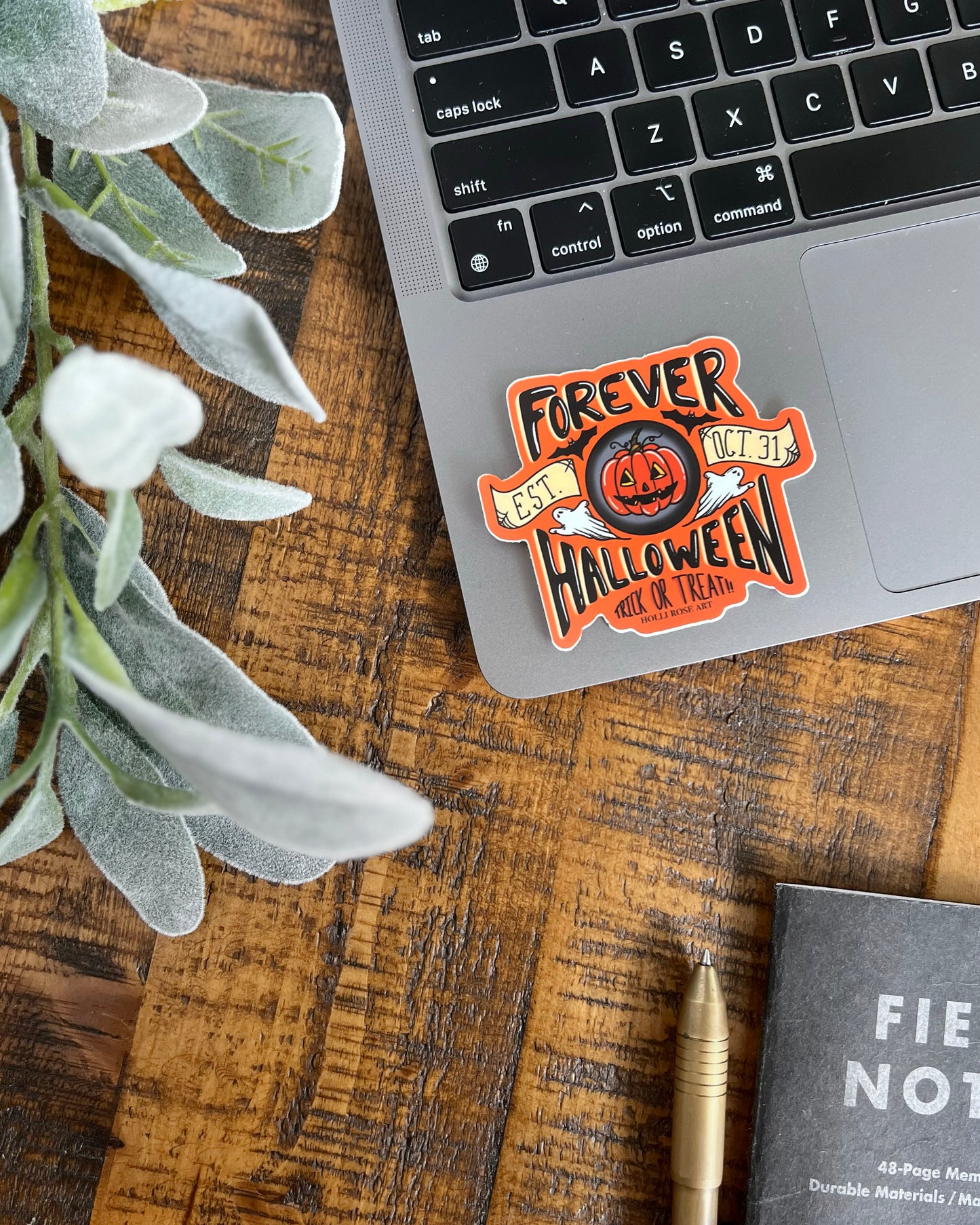 Halloween themed sticker on a laptop