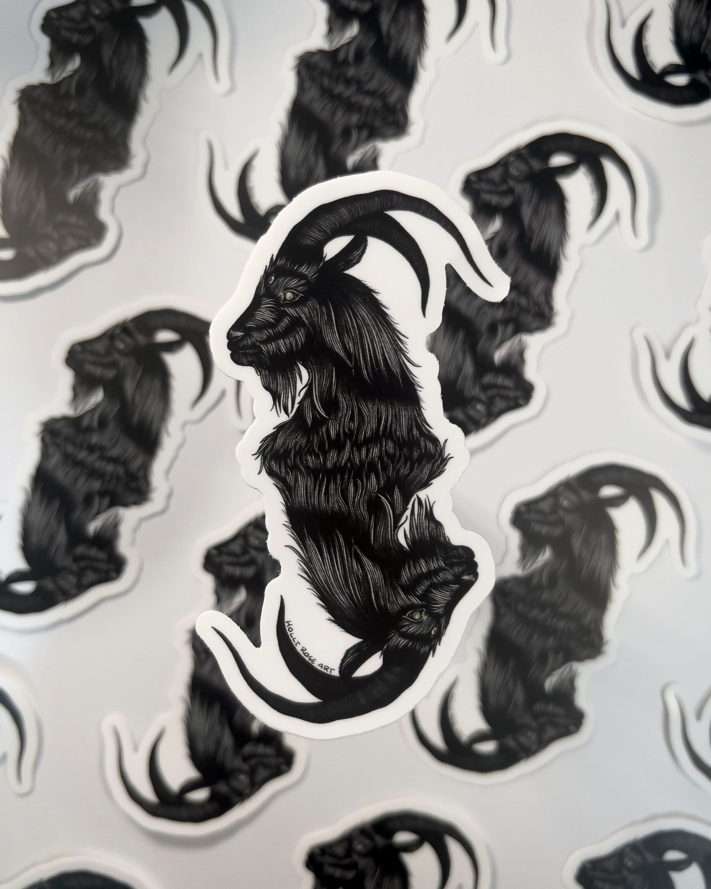 a sticker with a double headed goat