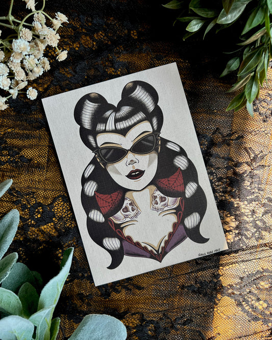 a goth girl wearing bat glasses with pinup haired skull tattoos on her neck. This is an art print