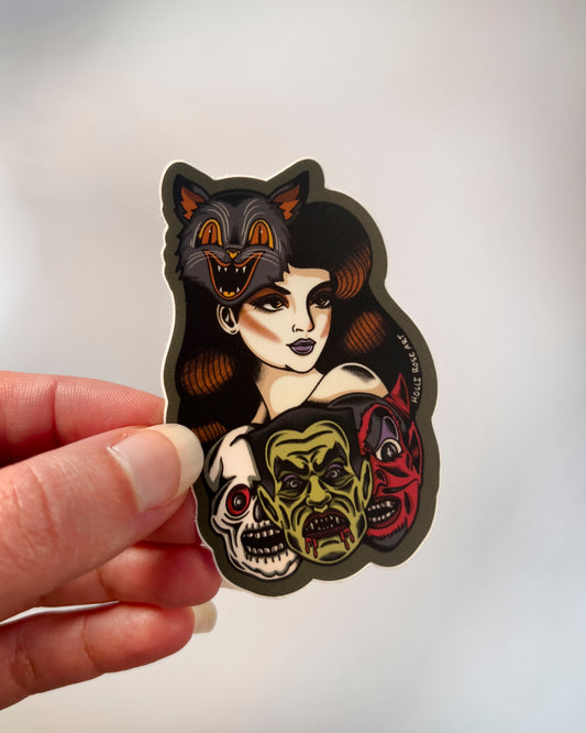 Sticker of a woman wearing a cat mask and monster masks under her