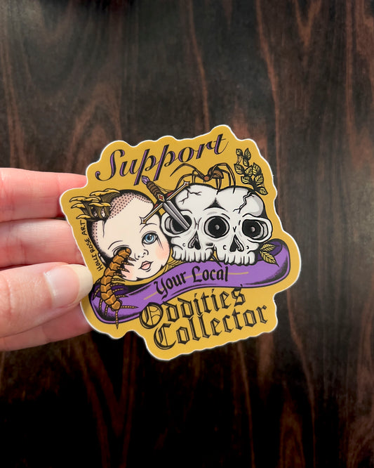 a sticker that says support your local oddities collector with a doll head, double headed skull, and bugs