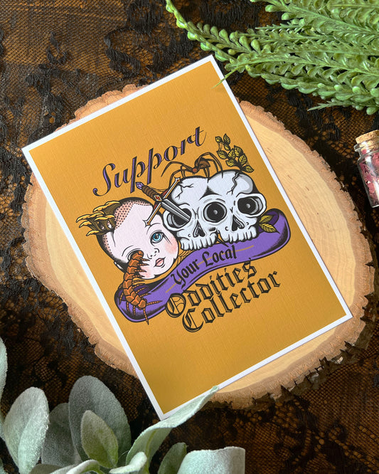 art print that says support your local oddities collect with a doll head, double skull, dagger and bugs