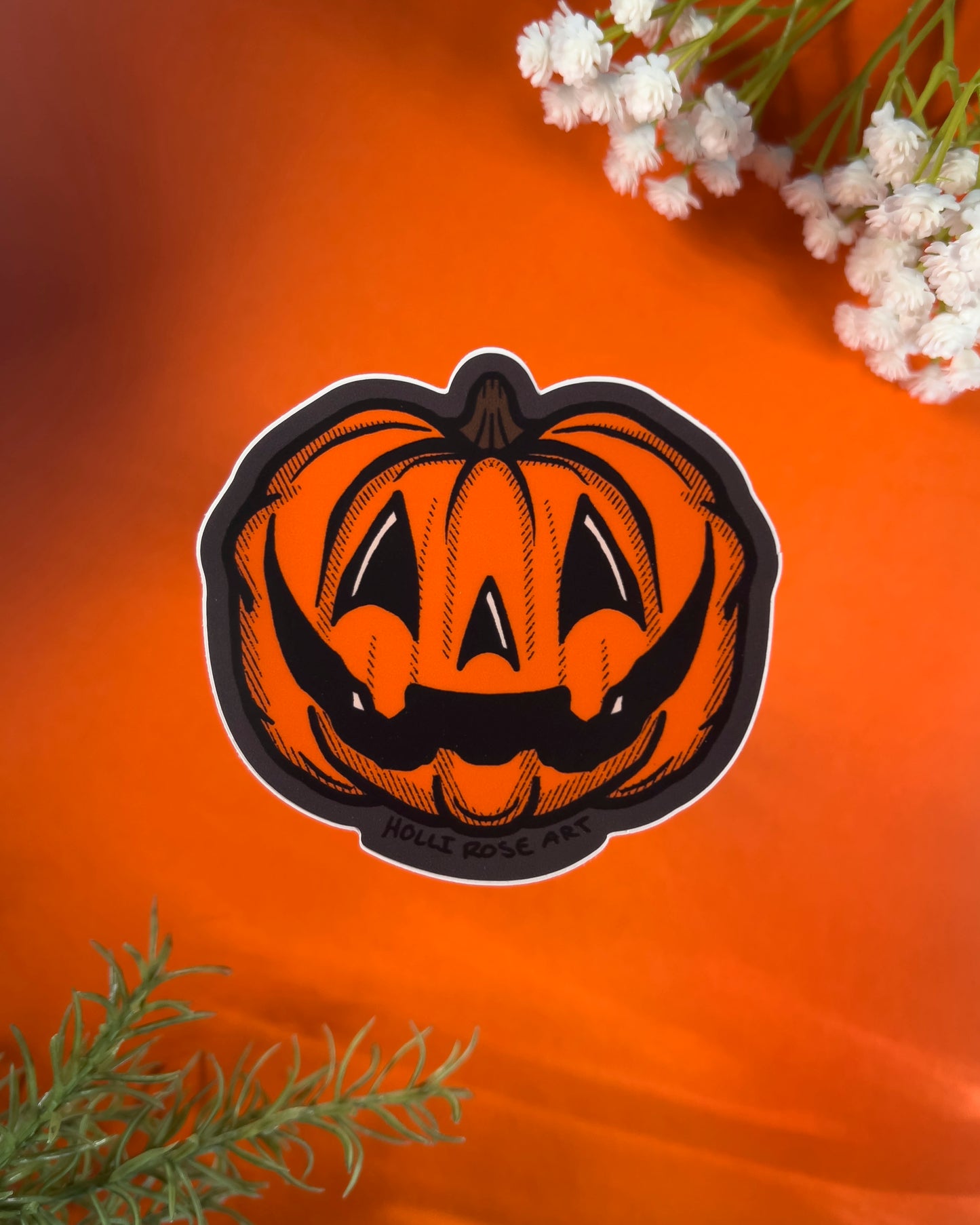 orange jack o lantern sticker on an orange background