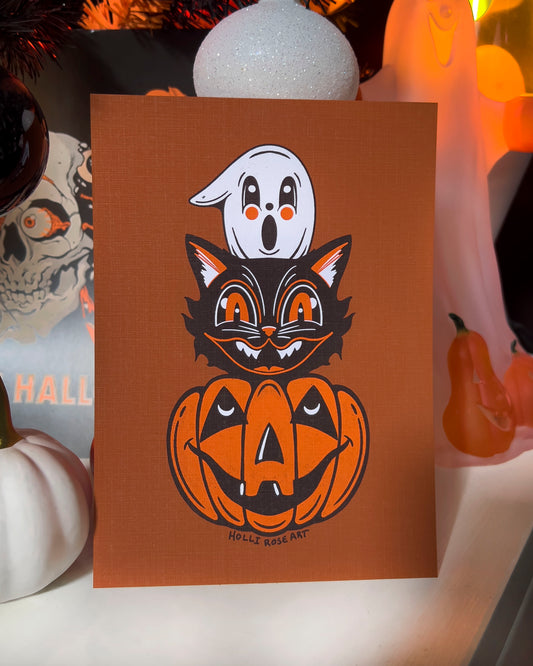 Halloween themed drawing art print with a ghost, cat and pumpkin head stacked on eachtoher