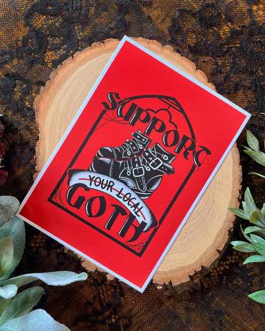 art print with support your local goth on it with goth boots and red background