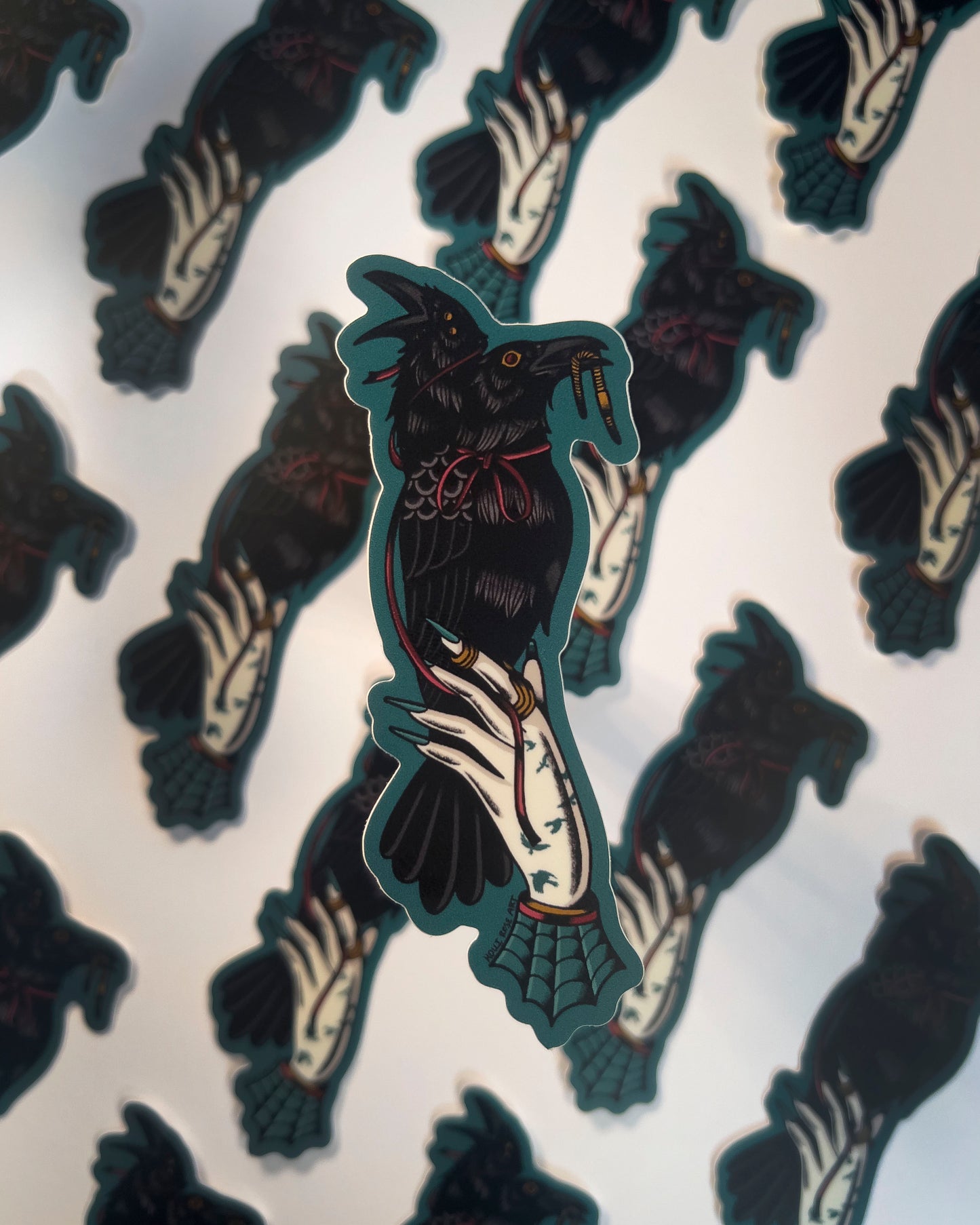 2 headed raven perched on a hand sticker