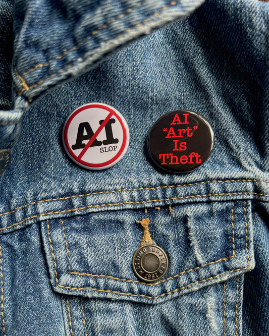 2 pins on a jean jacket against ai