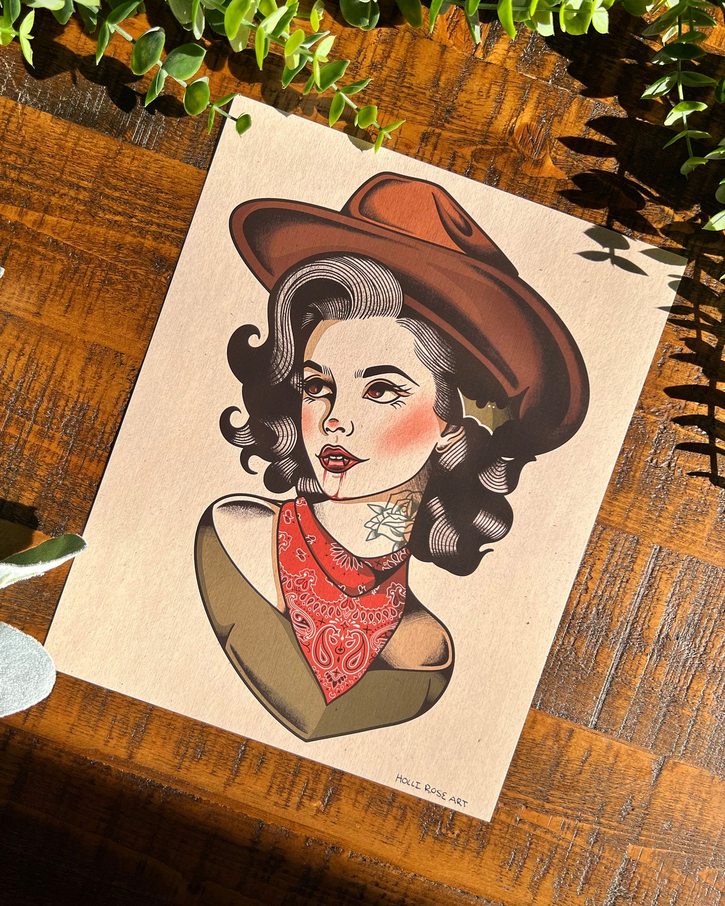 Illustration of a vintage woman wearing a brown hat and red bandana and blood dripping from her vampire teeth