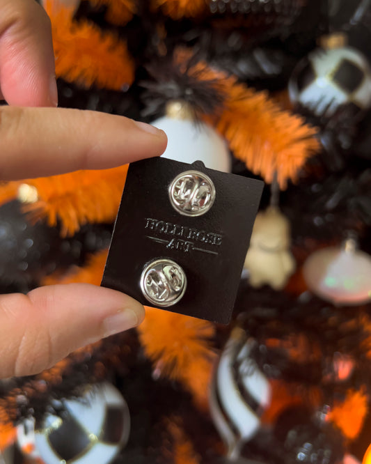 The back of an enamel pin 