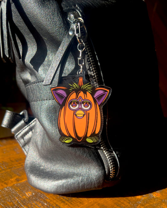 Pumpkin-shaped keychain with cat ears and eyes 