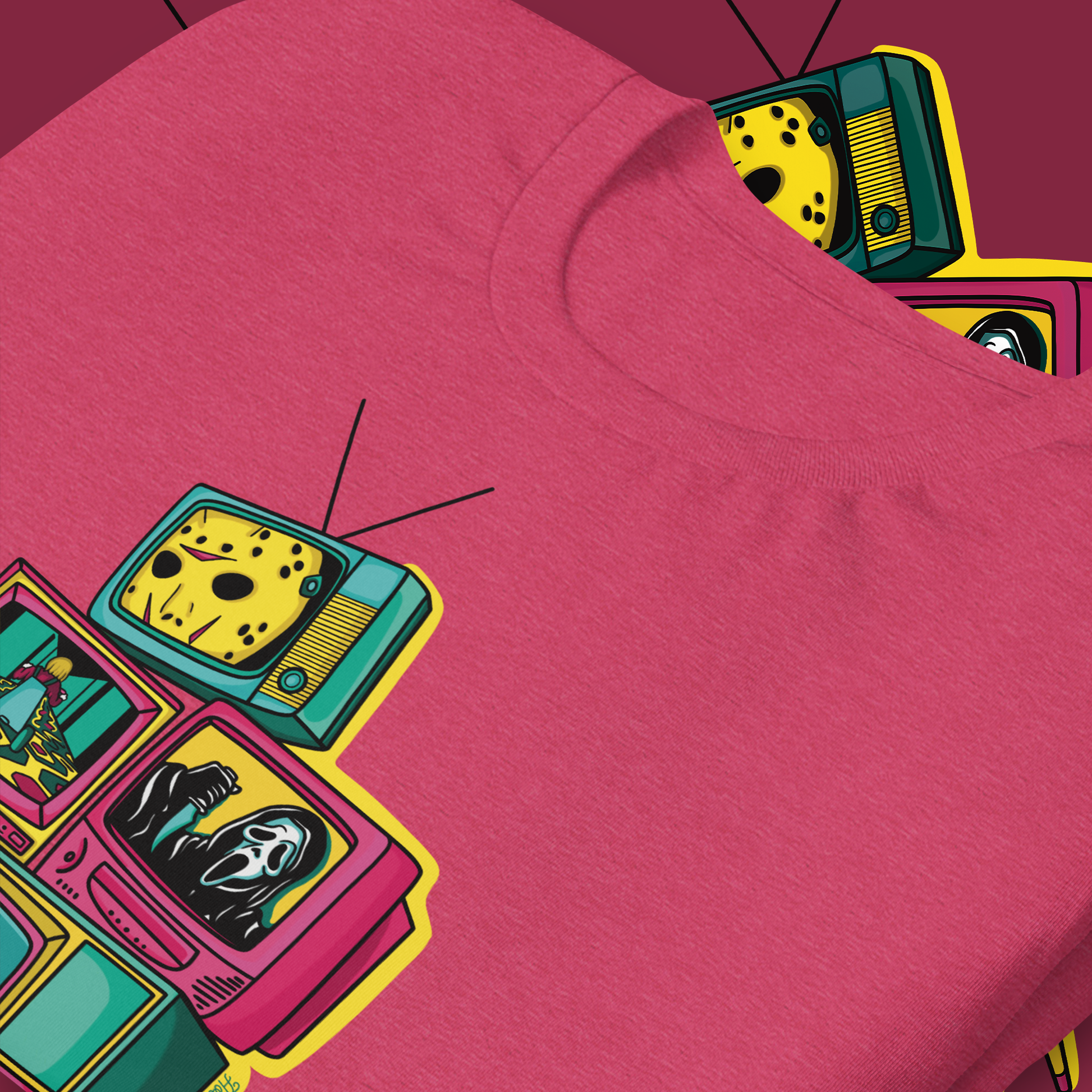 A heather raspberry colored t-shirt with a graphic print of multiple vintage television sets displaying various classic horror movie scenes.