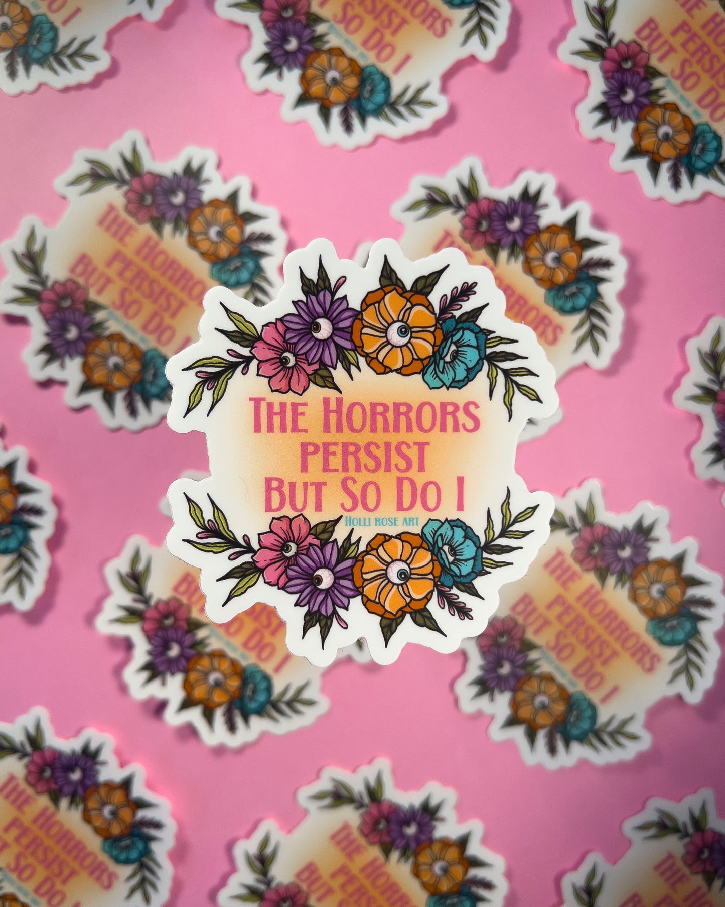 Sticker with floral design and text 'The Horrors Persist But So Do I' on a pink background