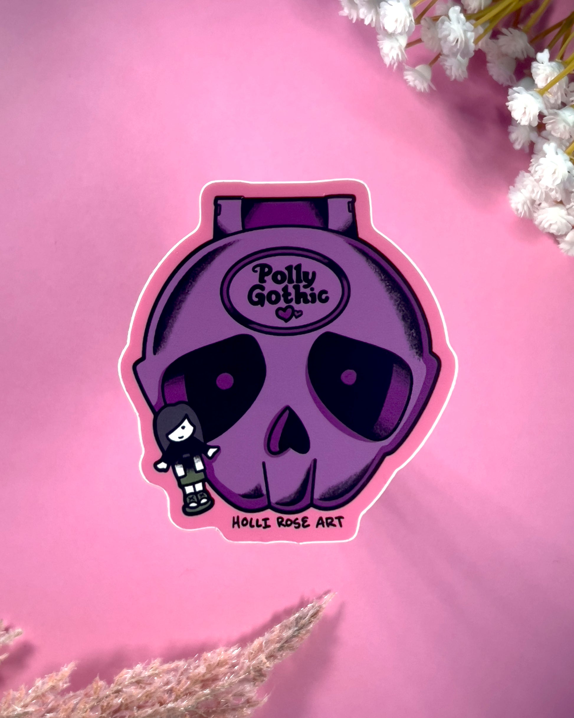 Purple skull design with 'Polly Gothic' text on a pink background with floral elements.