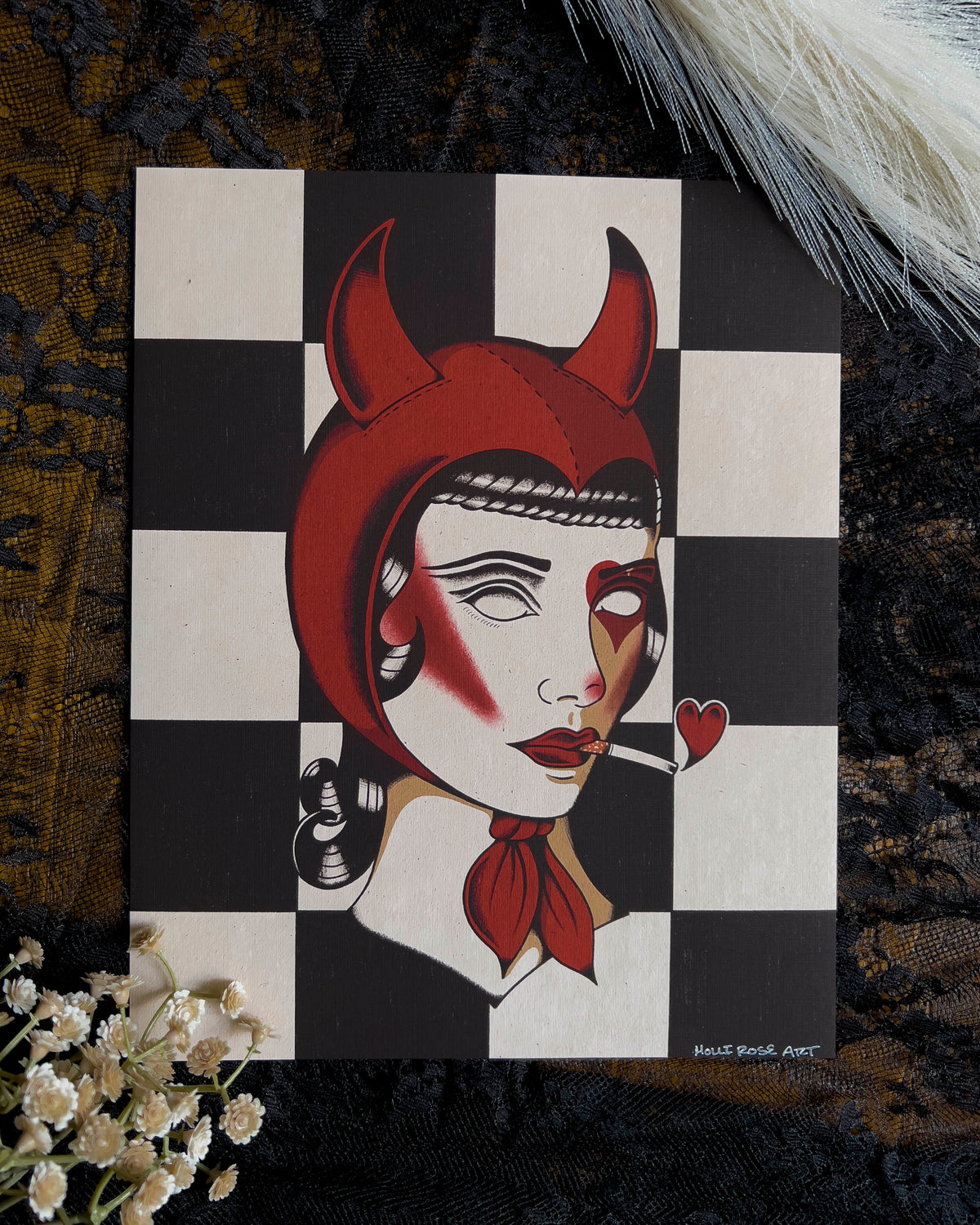 an art print with a girl wearing devil horns costume with a cigarette in her mouth and a heart coming out of the end of it
