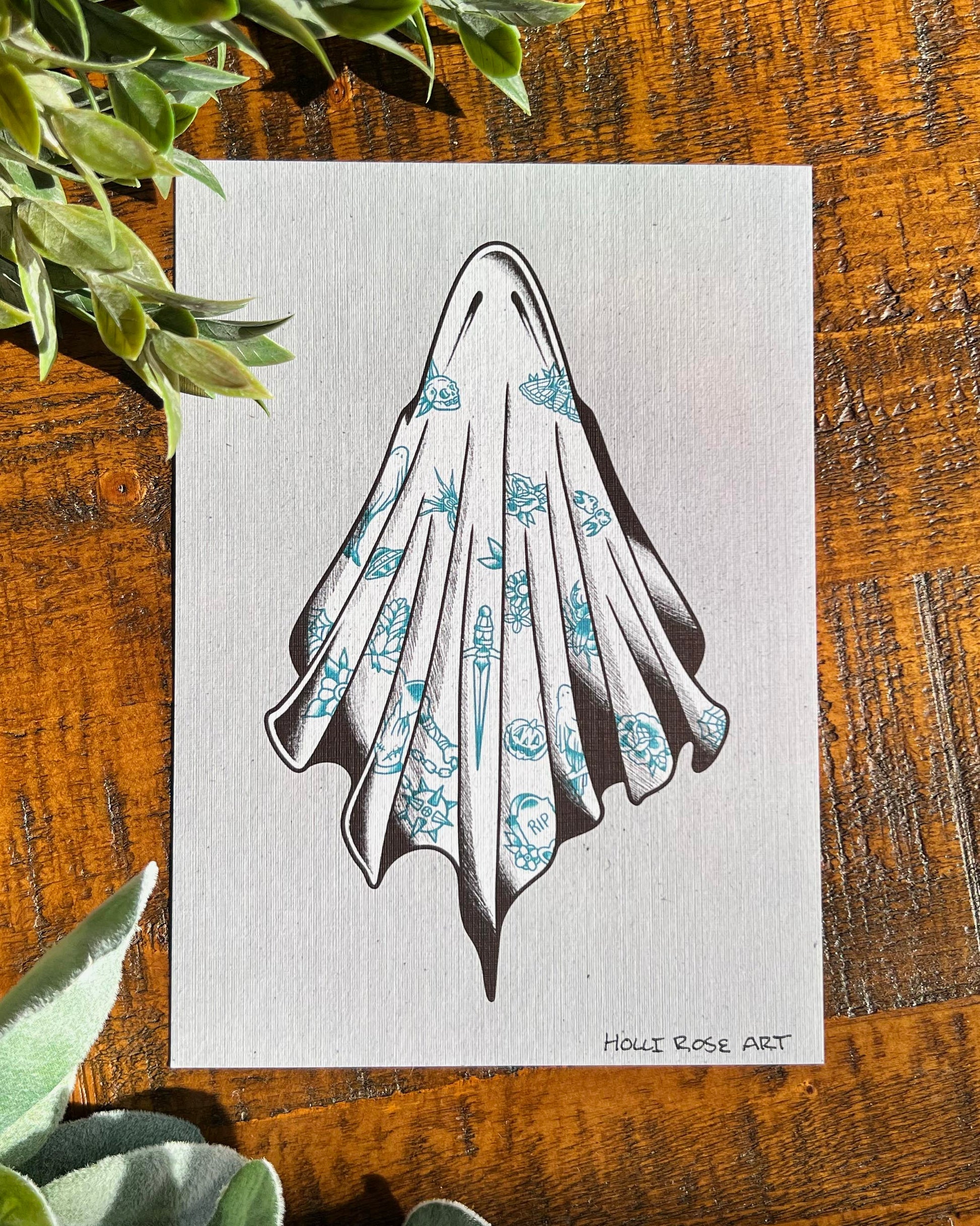 An art print with a ghost covered in tattoos, on a grey background