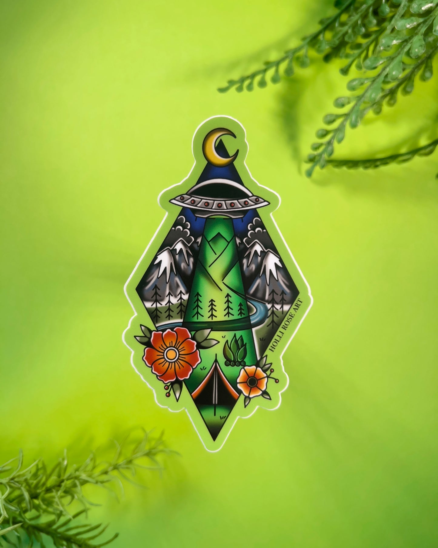 Decorative sticker with nature-themed alien abduction design on a green background