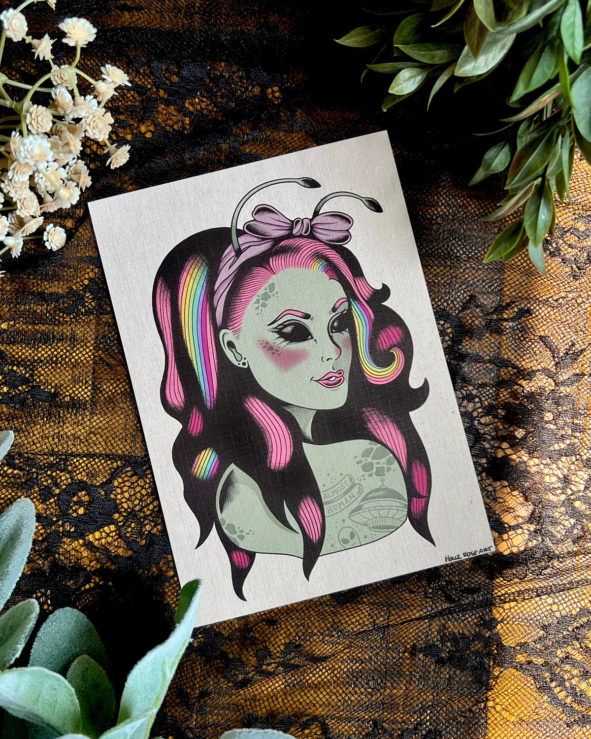 an art print of a green alien girl and rainbow and pink hair