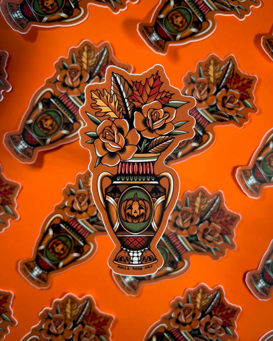 Decorative sticker with a vase and floral design on an orange background