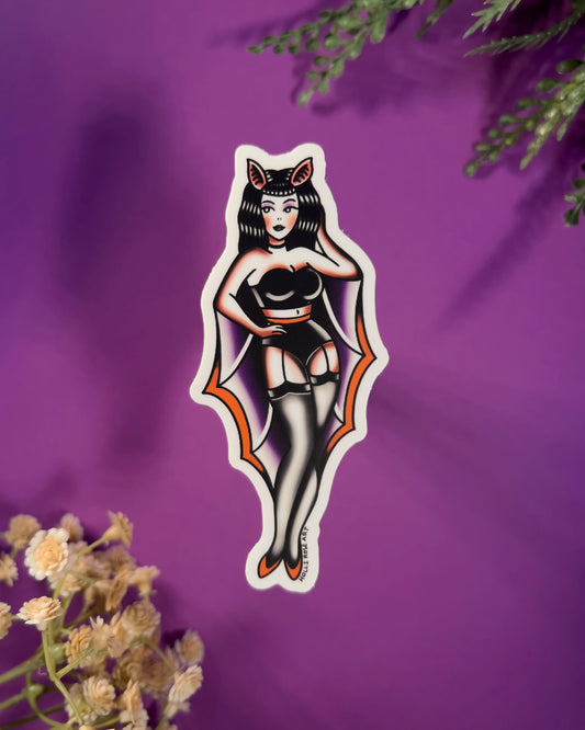 sticker of a pinup girl in a bat costume