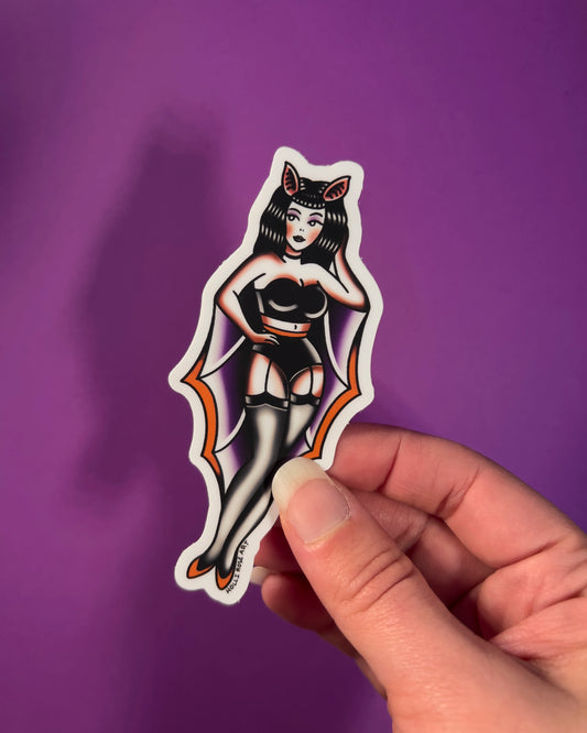 sticker of a pinup girl in a bat costume