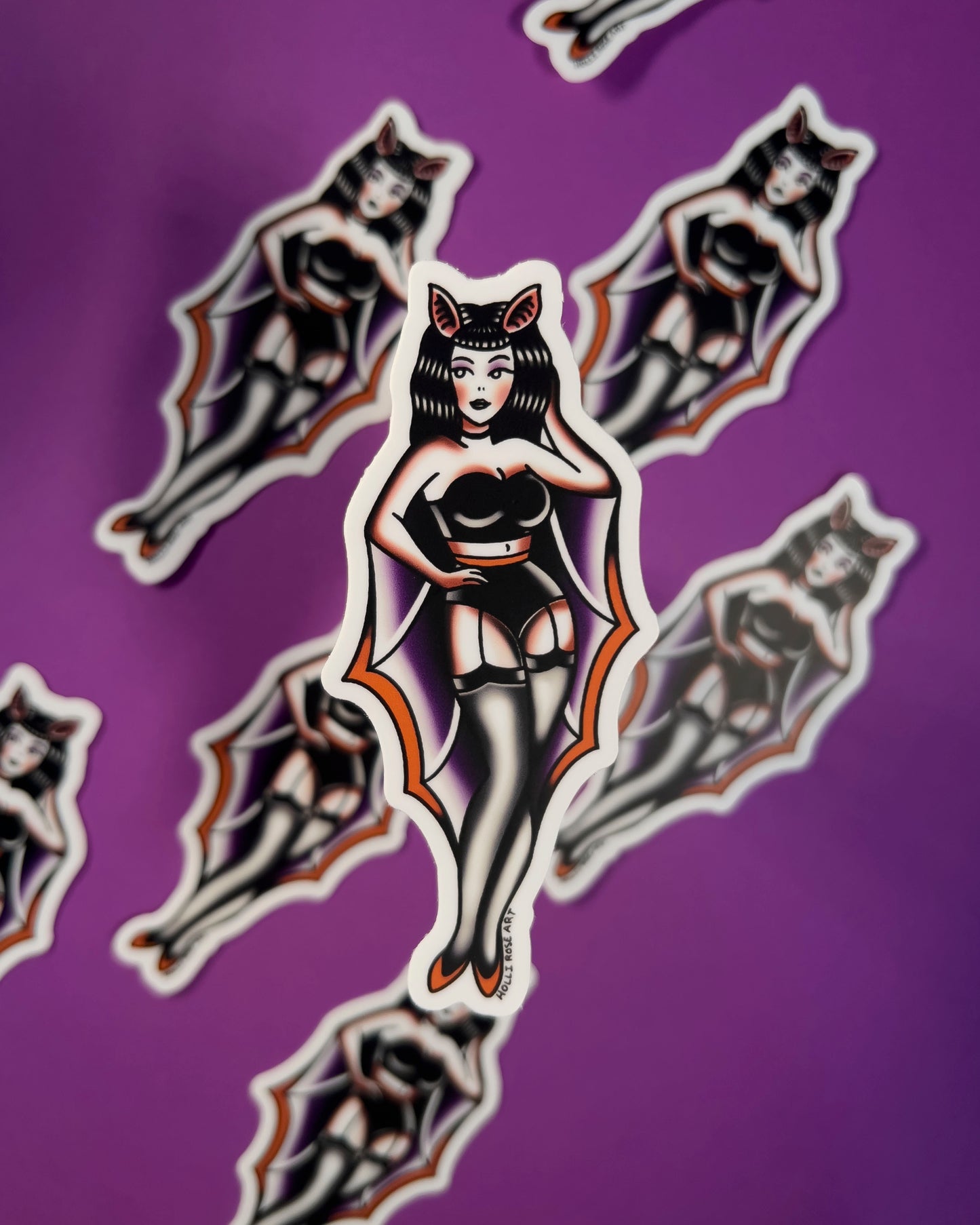 sticker of a pinup girl in a bat costume