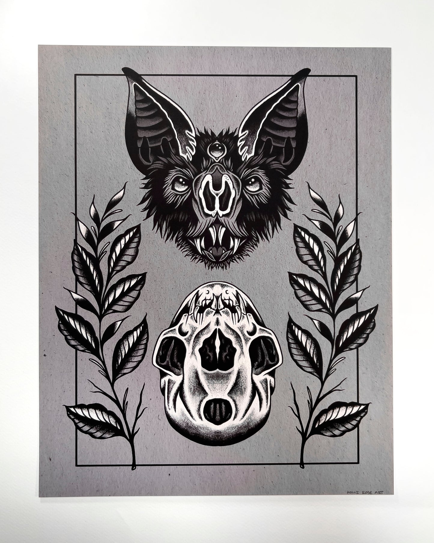 art print of a bat head and a bat skull below it