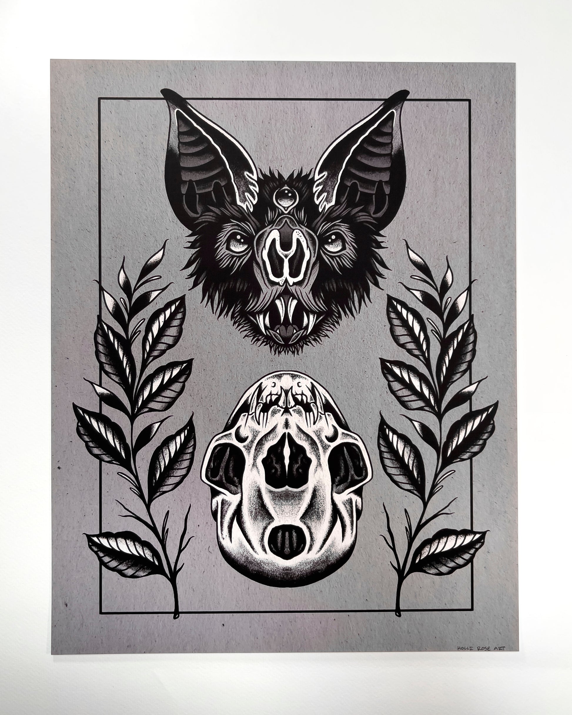 art print of a bat head and a bat skull below it