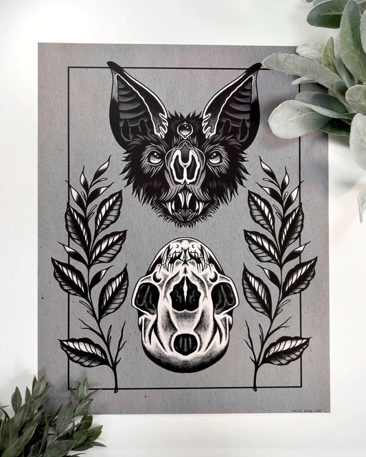 art print of a bat head and a bat skull below it