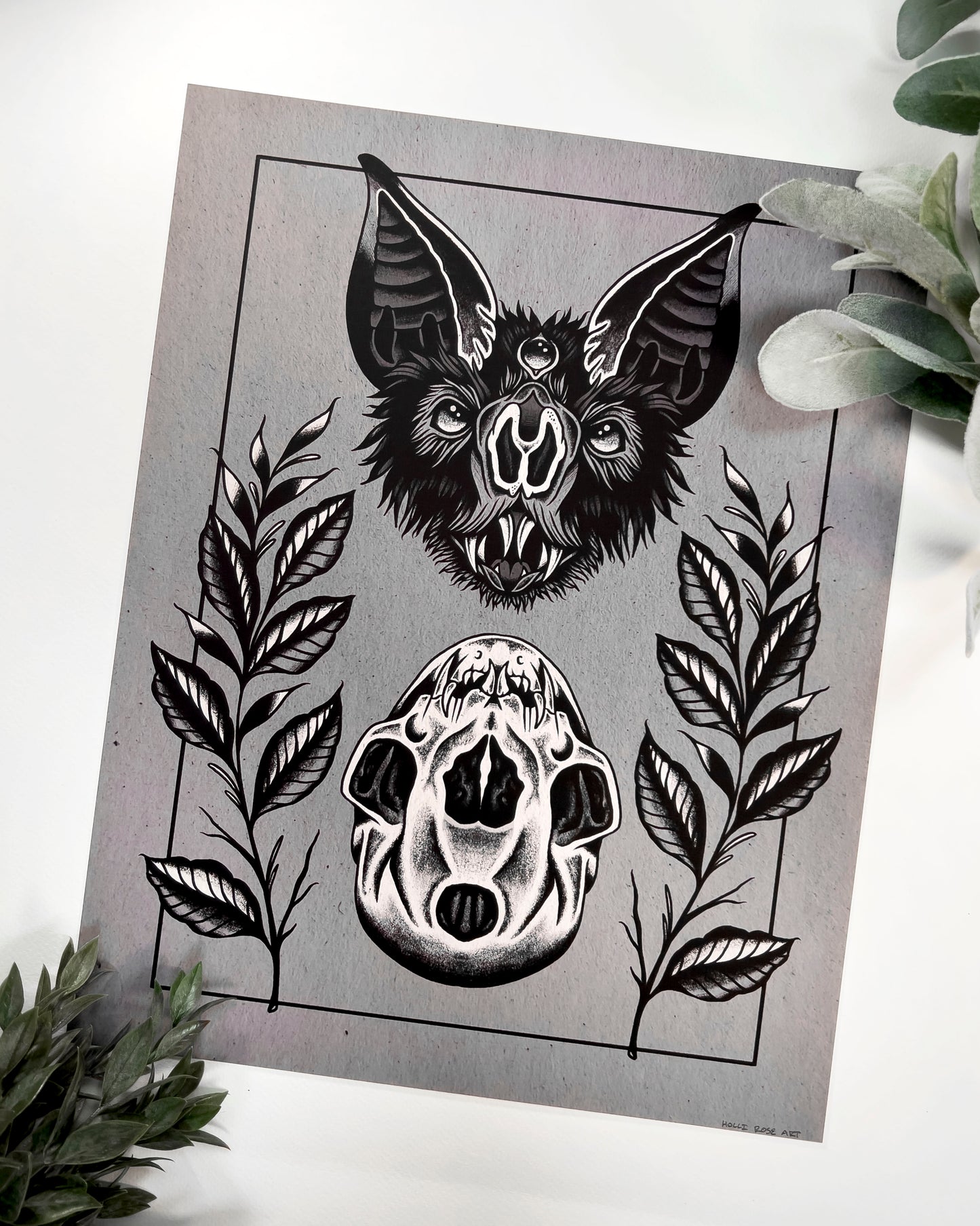 art print of a bat head and a bat skull below it