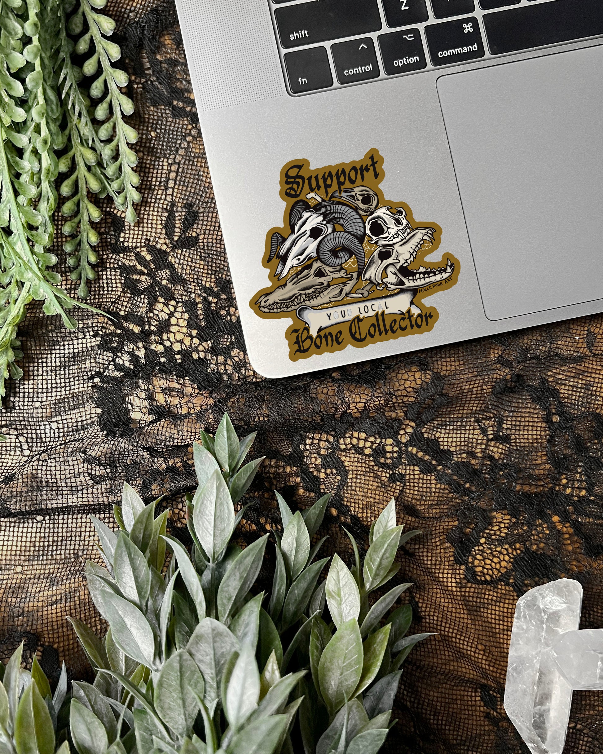 a sticker that says support your local bone collector with a stack of animal skulls 