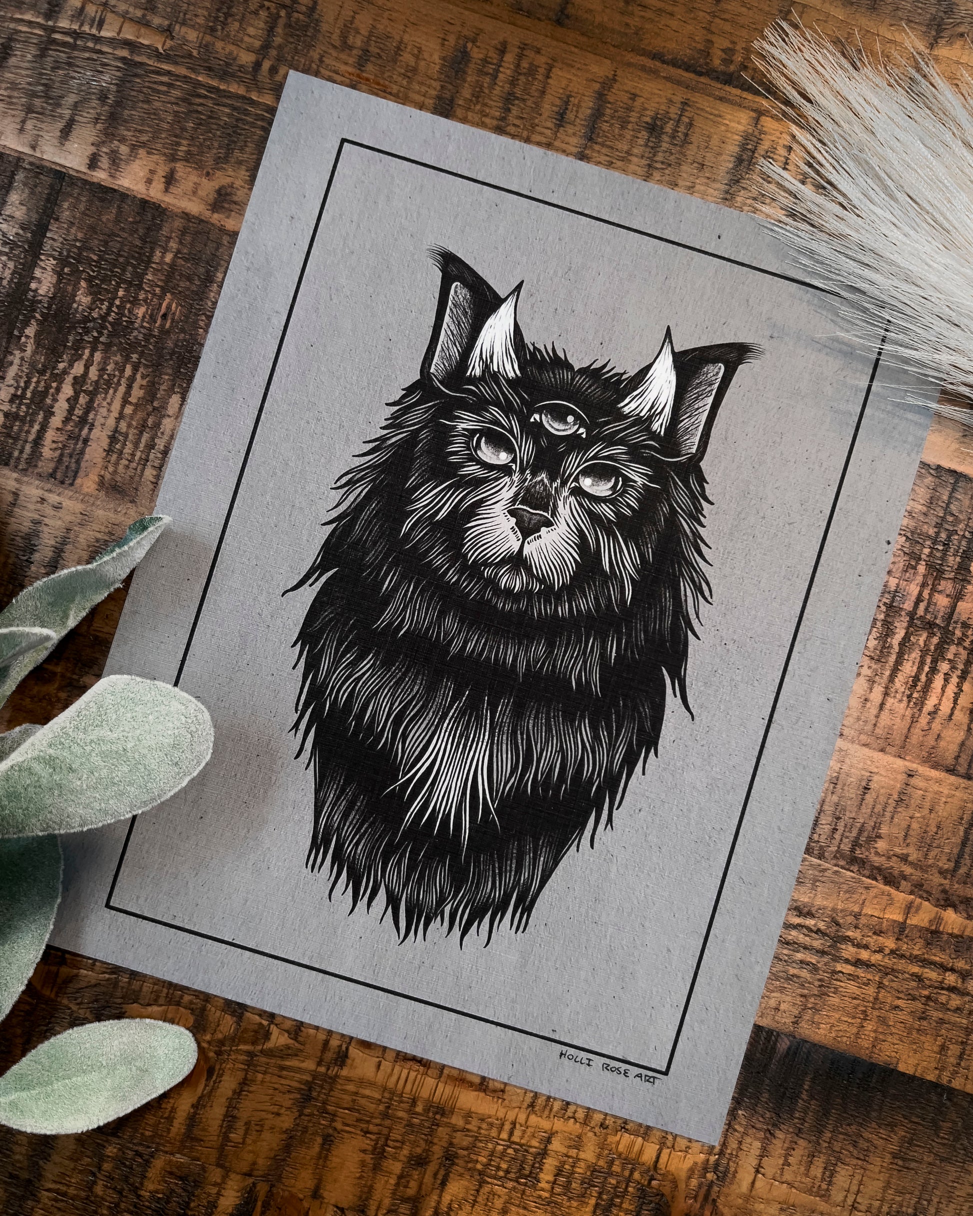 a cat with horns print