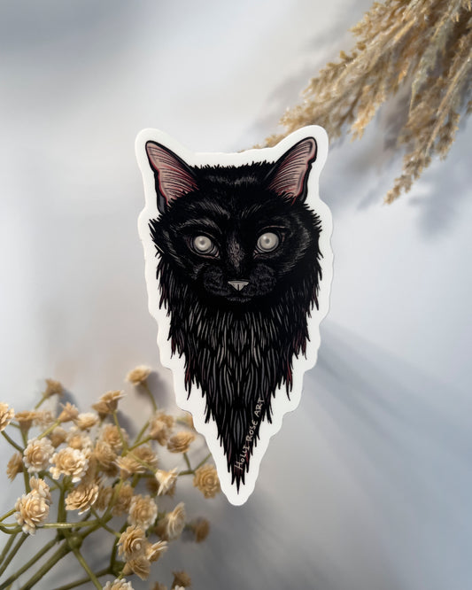 Sticker of a black cats head and blind eyes