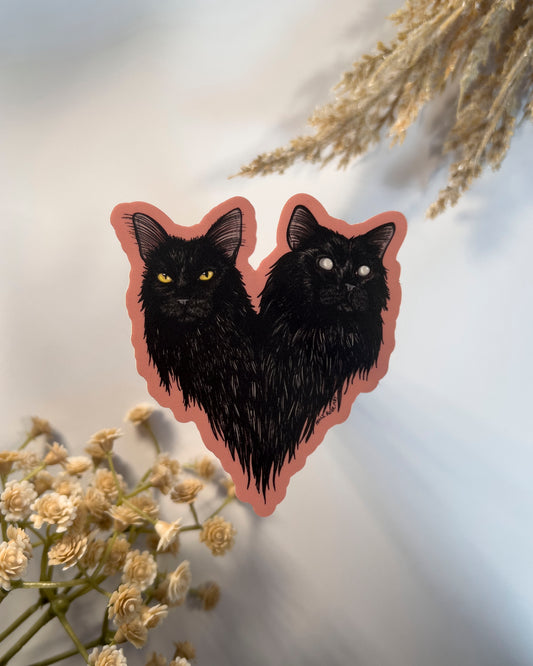 sticker of a double headed black cat