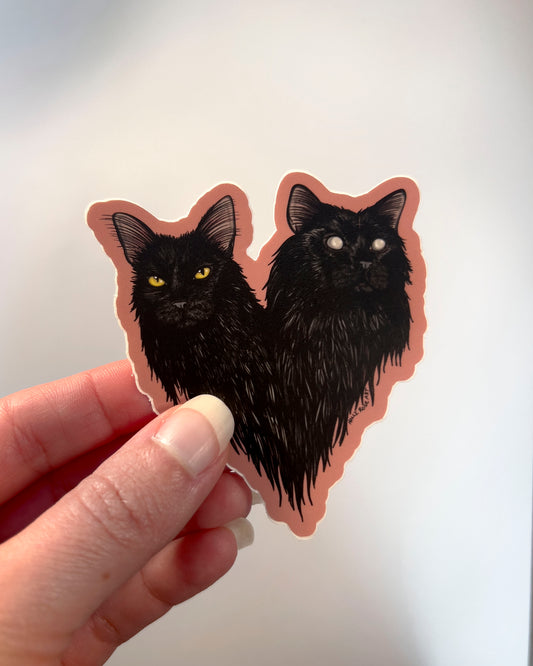 sticker of a double headed black cat