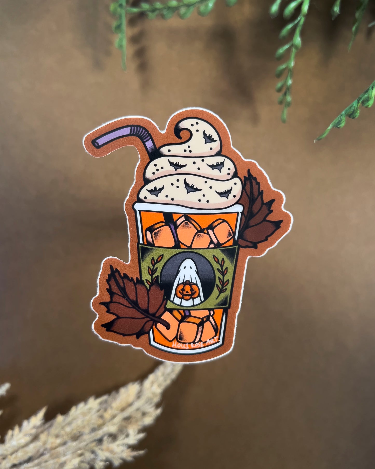 sticker of an iced pumpkin spice latte and leaves 
