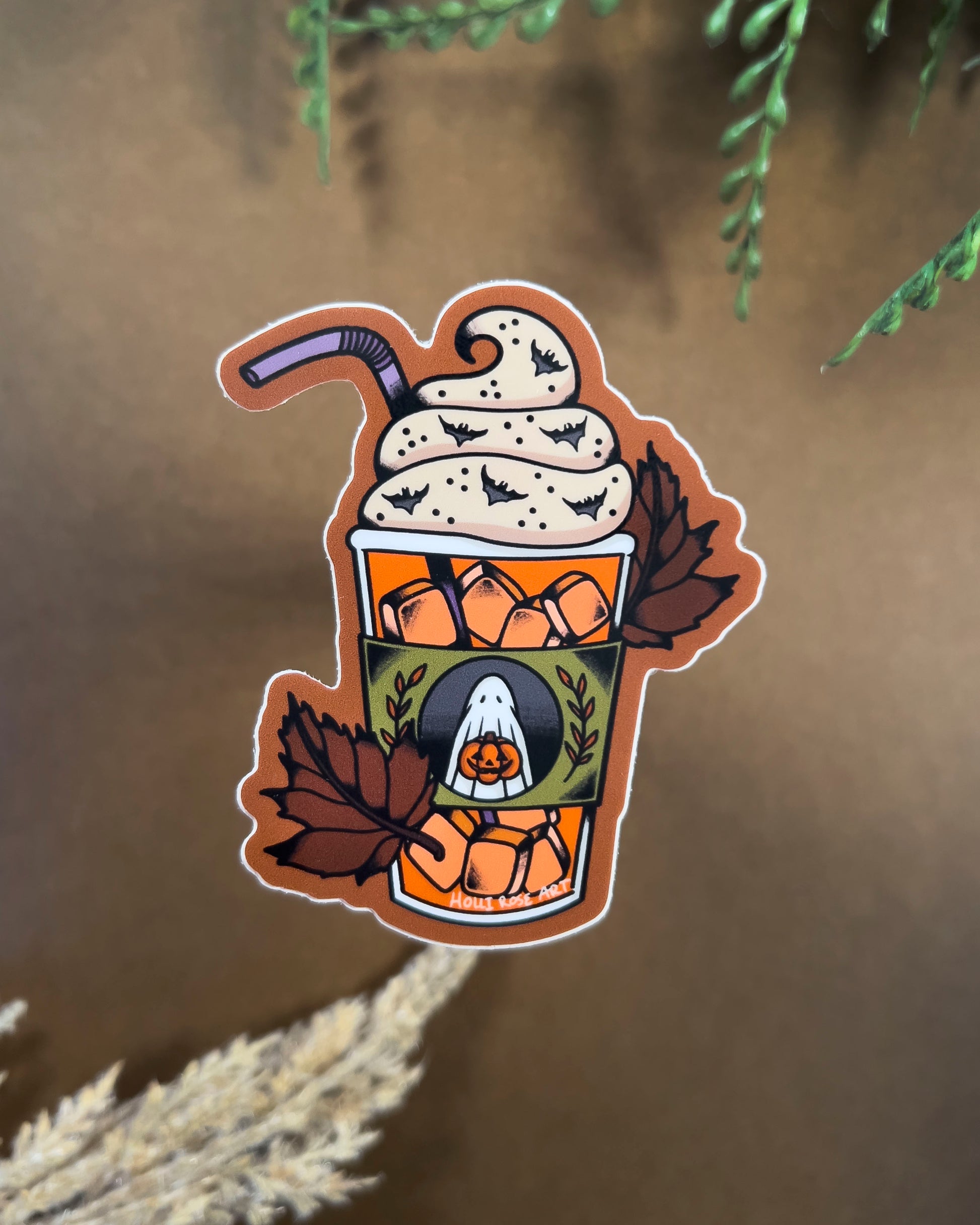 sticker of an iced pumpkin spice latte and leaves 