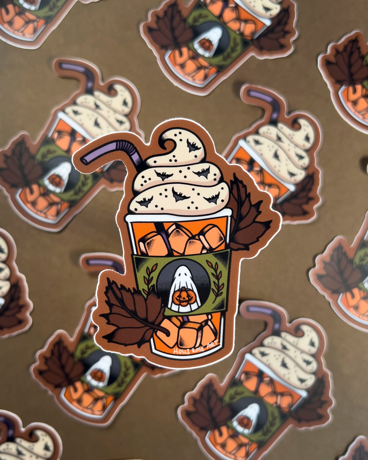 sticker of an iced pumpkin spice latte and leaves 