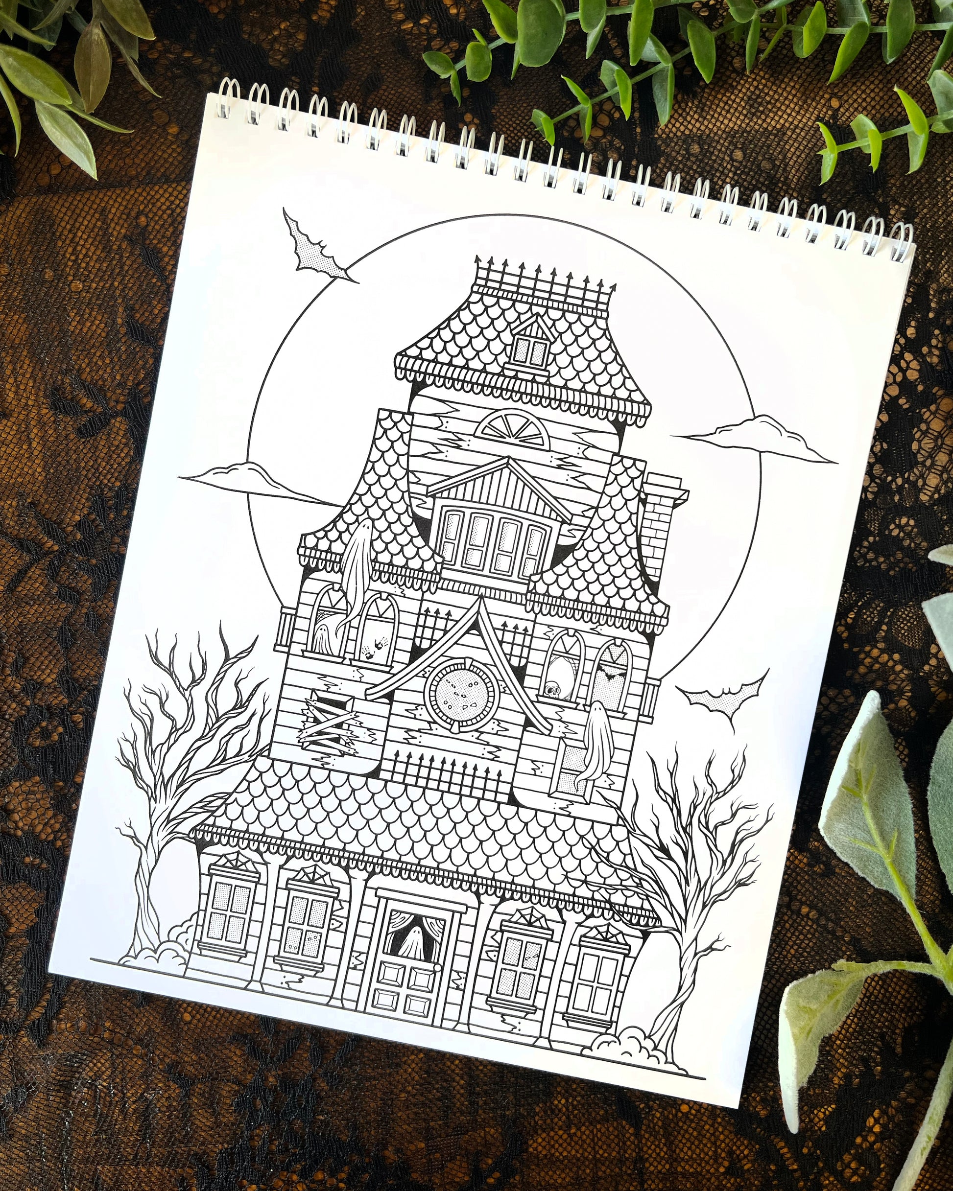 a coloring page with a haunted house