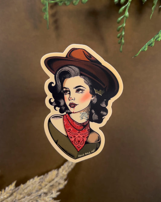 sticker of a woman in a cowboy hat, with vampire teeth and blood running down her chin