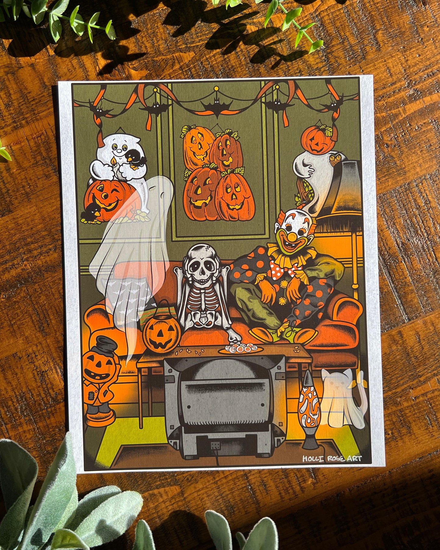 Halloween-themed illustration with ghosts, skeletons, and pumpkins on a wooden surface.