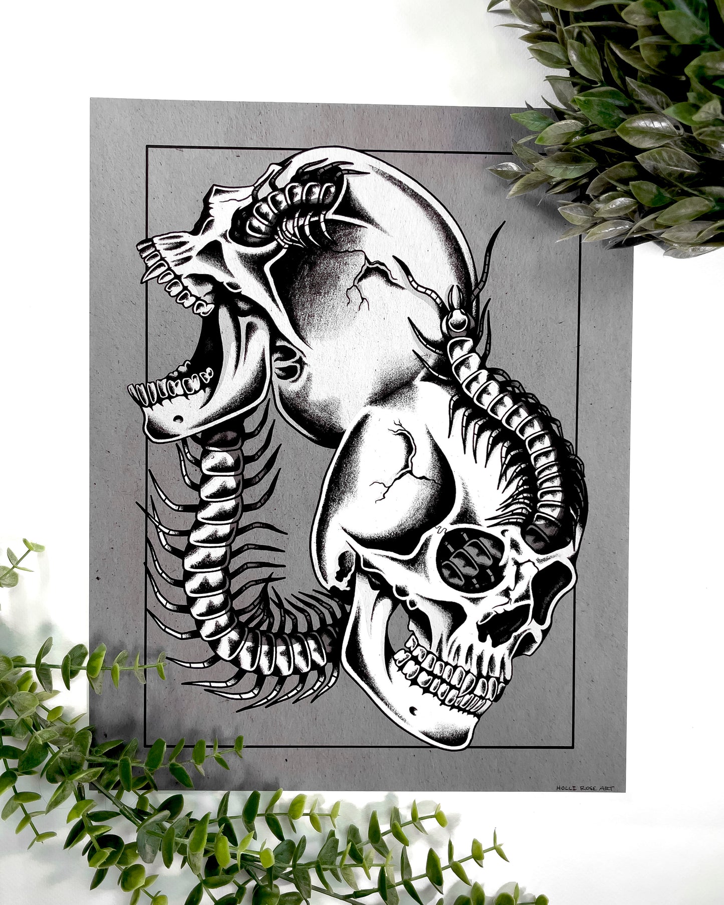 2 skulls combined with a centipede going through it print
