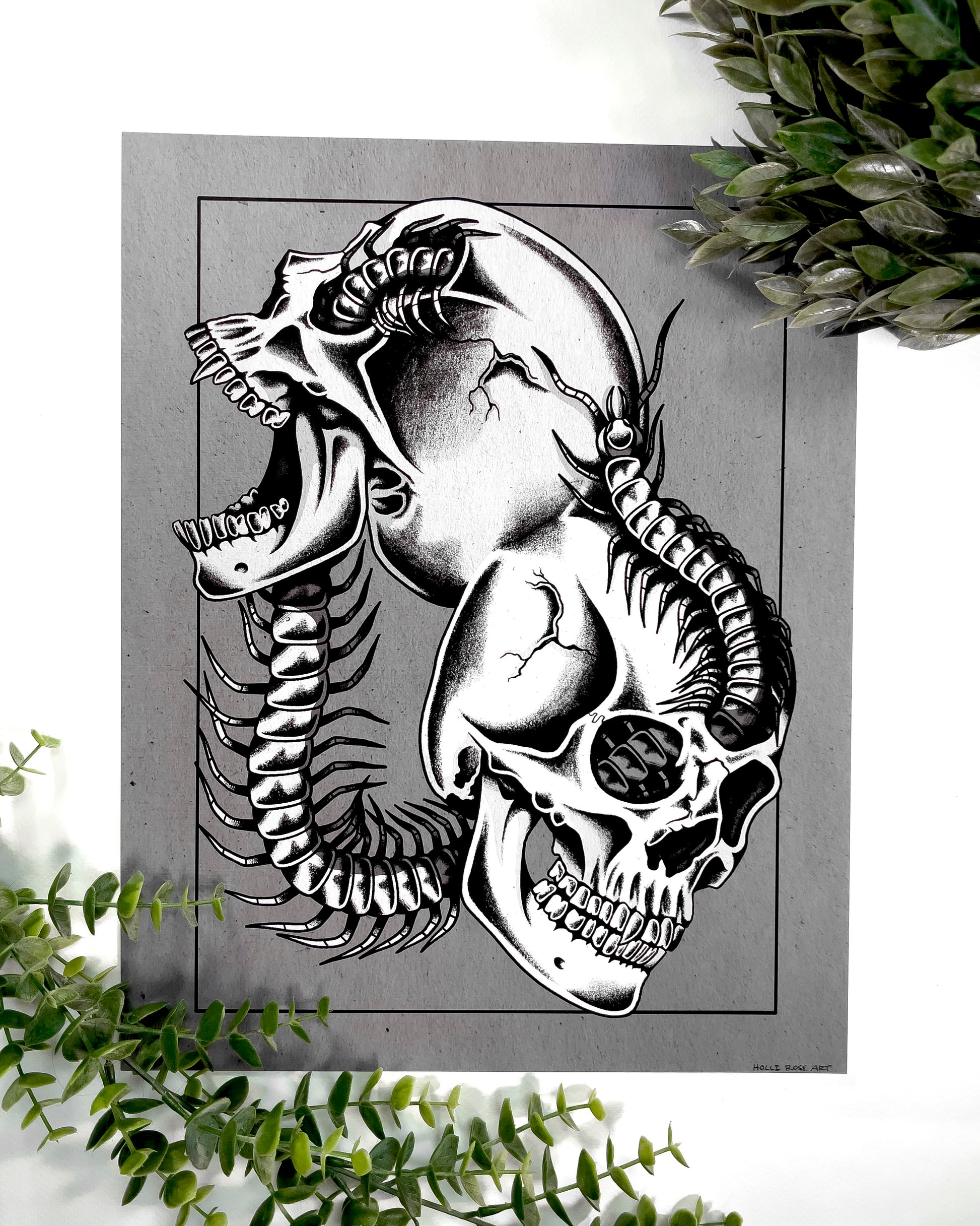 2 skulls combined with a centipede going through it print