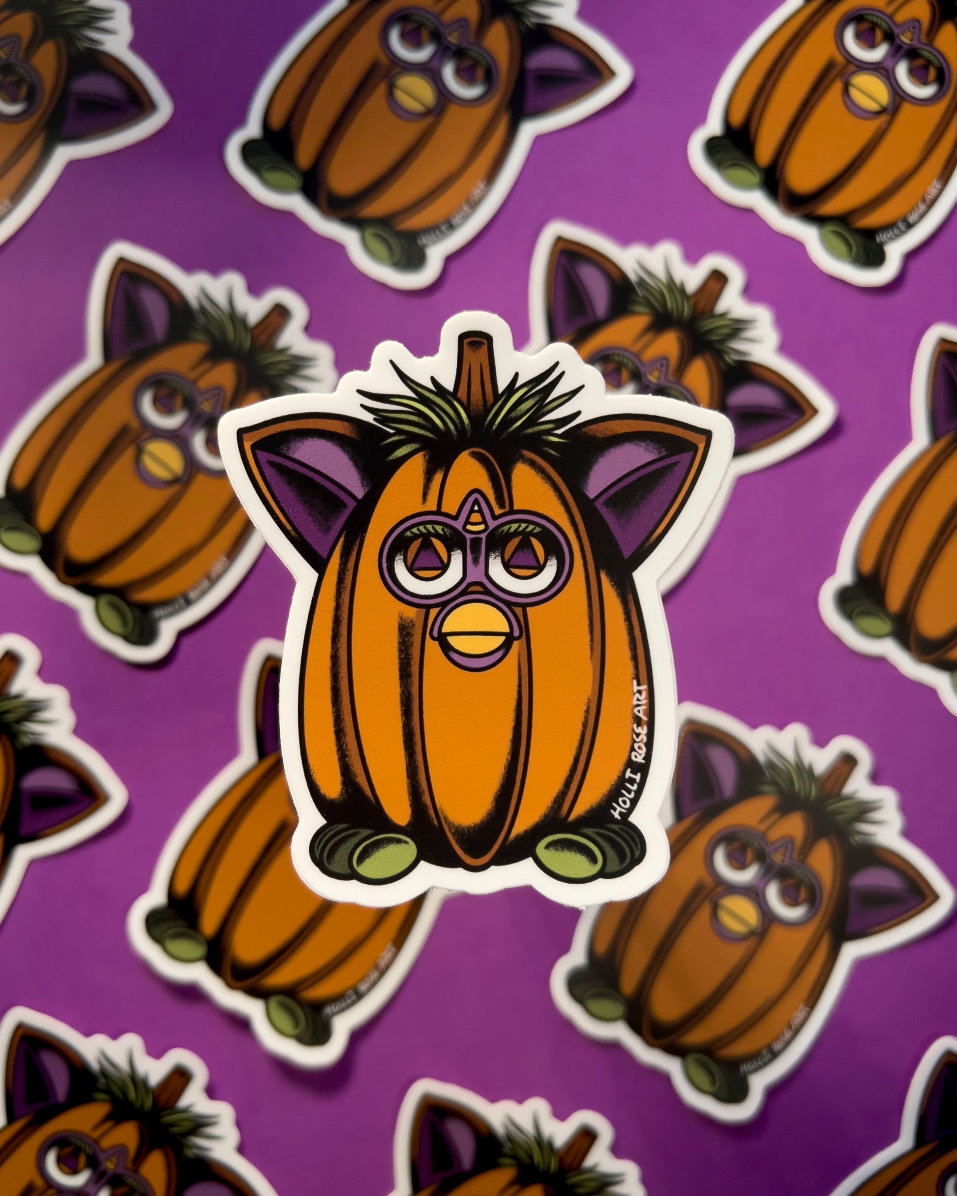 a little creature shaped as a pumpkin sticker 