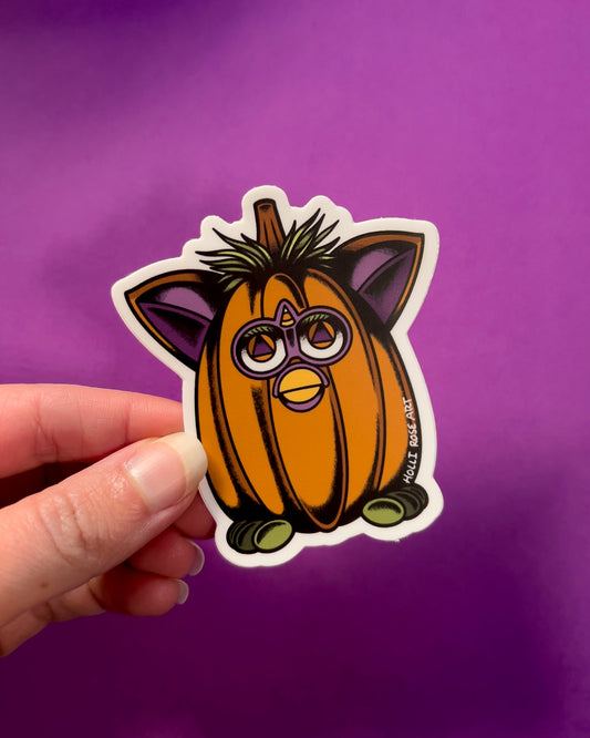 a little creature shaped as a pumpkin sticker 