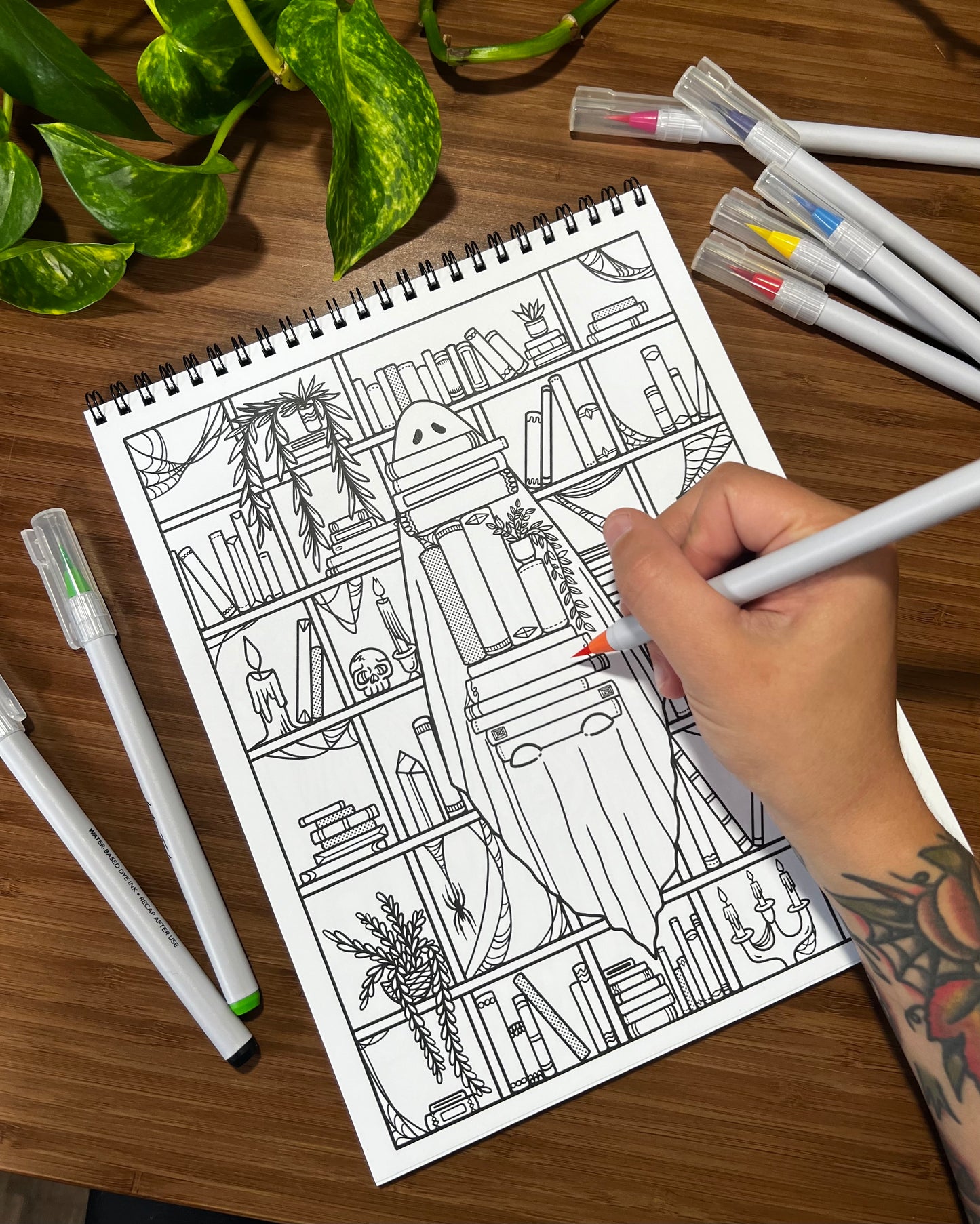 a coloring page featuring a ghost in a library