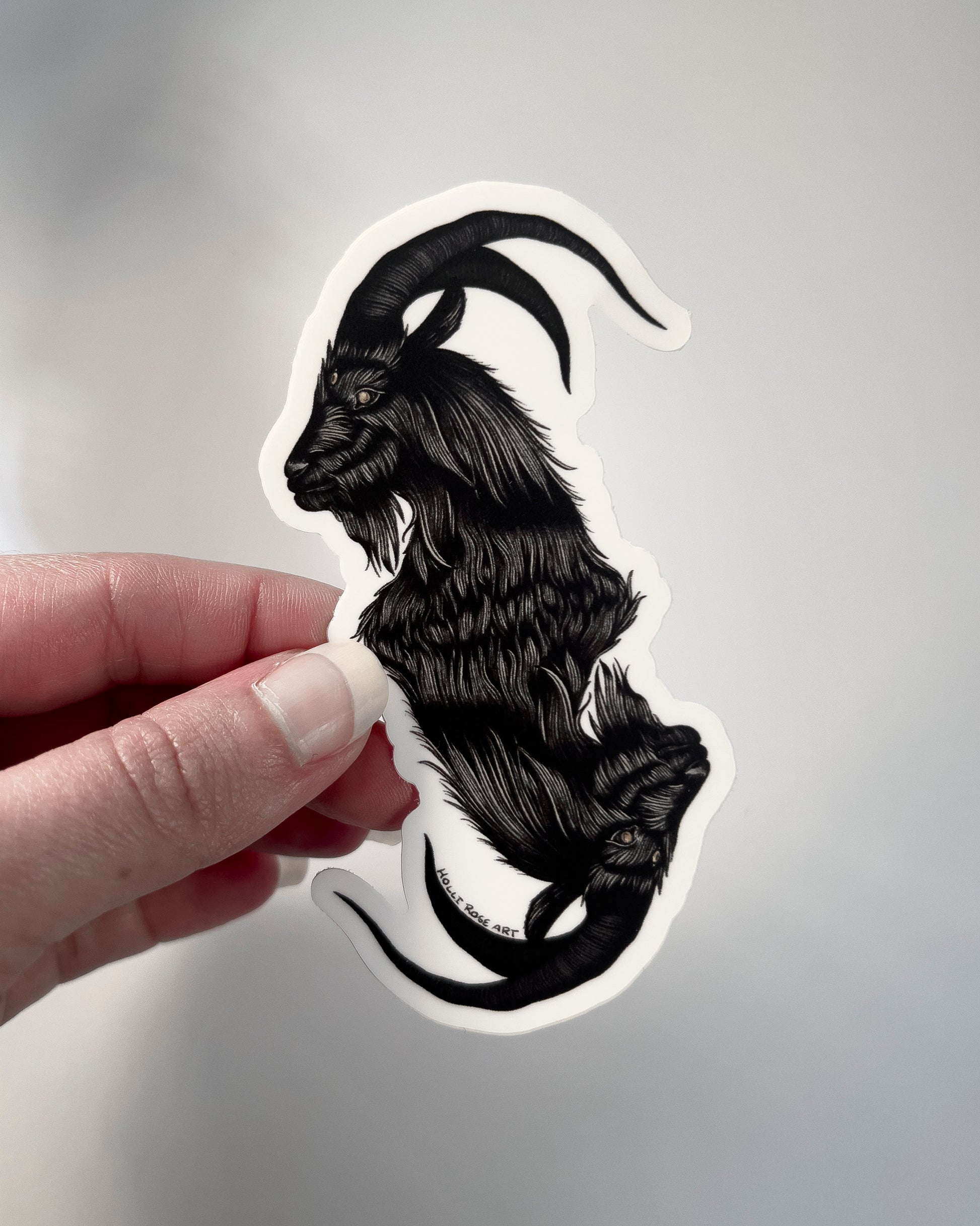a sticker with a double headed goat 
