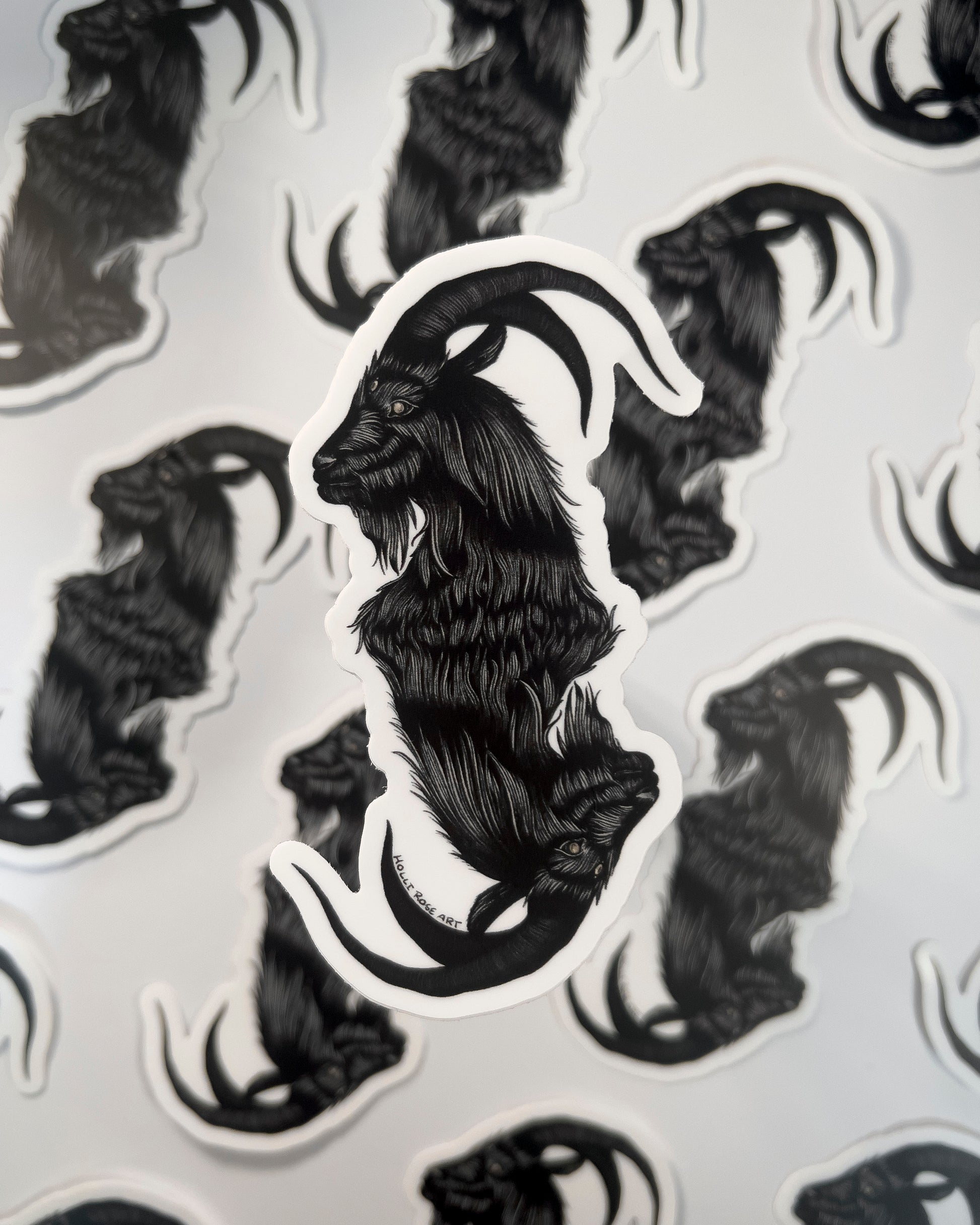 a sticker with a double headed goat 